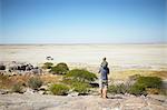 Father and son enjoying view, Kubu Island, Makgadikgadi Pan, Botswana, Africa