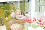 Mother and son sharing a drink together, view through window