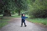 Female toddler walking on forest path, Yosemite National Park, California, USA