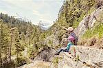 Father and child enjoying view on hill, Ehrwald, Tyrol, Austria