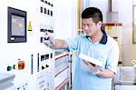 Man at work in flexible electronics plant