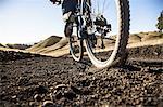 Cropped surface view of young man mountain biking on dirt track, Mount Diablo, Bay Area, California, USA