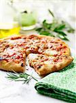 Italian pizza with vintage table cloth and olive oil