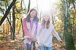 Teenage girls in forest looking at camera smiling