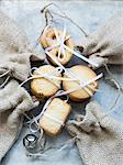 Overhead view of shortbread cookies tied with white ribbon and burlap bags