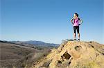 Mature female runner looking out from hill, Thousand Oaks, California, USA