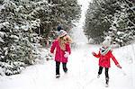 Sisters playing in snow