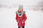 Young girl walking in snow