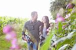 Romantic couple strolling in field