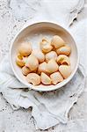 Still life of bowl of raw conchiglione pasta