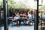 Group of friends toasting at garden party