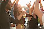 Adult friends dancing at waterfront roof terrace party, Budapest, Hungary