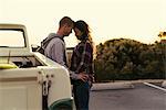 Romantic couple with pickup truck at Newport Beach, California, USA