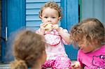 Girl eating apple on steps