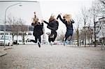 Girls jumping together