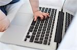 Babys hand on laptop keyboard