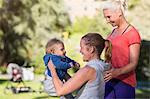 Women with baby boy in park