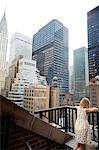 Girl looking at skyscrapers