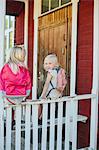 Girls sitting on porch