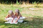 Boy and girl bathing in washbasin