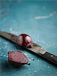 Beetroot and knife on table