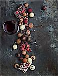 Red wine and various chocolate truffles and sweets