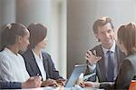 Businessman leading conference room meeting