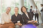 Portrait smiling businesswomen meeting in office lobby