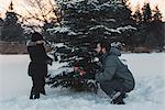 Father and daughter choosing their own Christmas tree