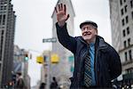 Man waving and smiling, Manhattan, New York, USA