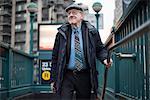 Man walking up subway stairway, Manhattan, New York, USA