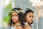 Portrait of two girls, wearing butterflies in hair