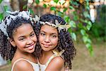 Portrait of two girls, wearing butterflies in hair