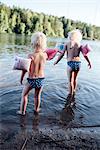 Girls playing in lake