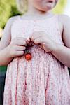 Girl holding strawberry