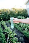 Hand with rain gauge