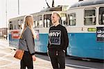 Friends talking on street