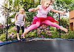 Girls jumping on trampoline
