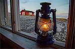 Kerosene lamp on window sill