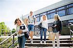 Teenage friends leaving school