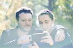 Man getting camera ready for selfie with girlfriend