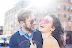 Couple laughing together outdoors