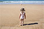 Little girl at the beach, rear view