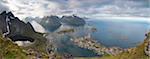 Panorama of the blue lake and sea framed by rocky peaks, Reinebringen, Moskenesoya, Lofoten Islands, Norway, Scandinavia, Europe