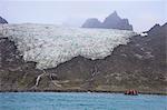 Tourists on a zodiac watching a glacier on Elephant Island, South Shetland Islands, Antarctica, Polar Regions