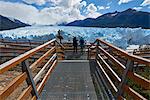 Two visitors at Perito Moreno Glacier in the Parque Nacional de los Glaciares (Los Glaciares National Park), UNESCO World Heritage Site, Patagonia, Argentina, South America