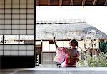 Caucasian woman wearing yukata in traditional Japanese house