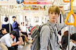 Caucasian tourist boarding a train, Tokyo, Japan