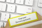 Career Development written on Yellow Card File Concept on Background of Modern Laptop Keyboard. Closeup View. Blurred Image. 3D Rendering.