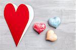 Love concept. Hearts on grey rustic background